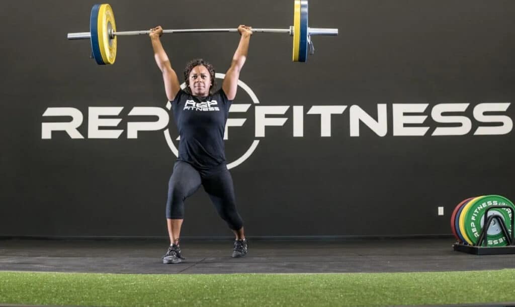 Rep Fitness Block Logo Womens Tee with a model